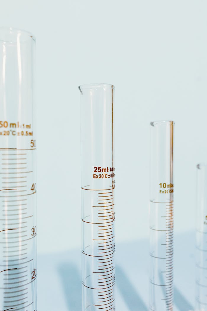 Detailed close-up of glass laboratory test tubes with measurements, ideal for scientific and research content.